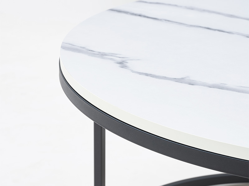 Large nesting coffee tables featuring high contrast white and black marble look finish