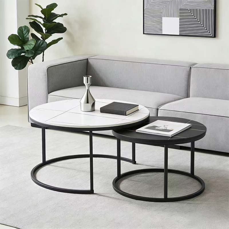 Modern nesting coffee table set styled in a luxury contemporary living room showroom