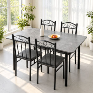 Grey stone-look dining table and four black scroll-back chairs beside a sunlit window Grey stone-look dining table and four black scroll-back chairs beside a sunlit window