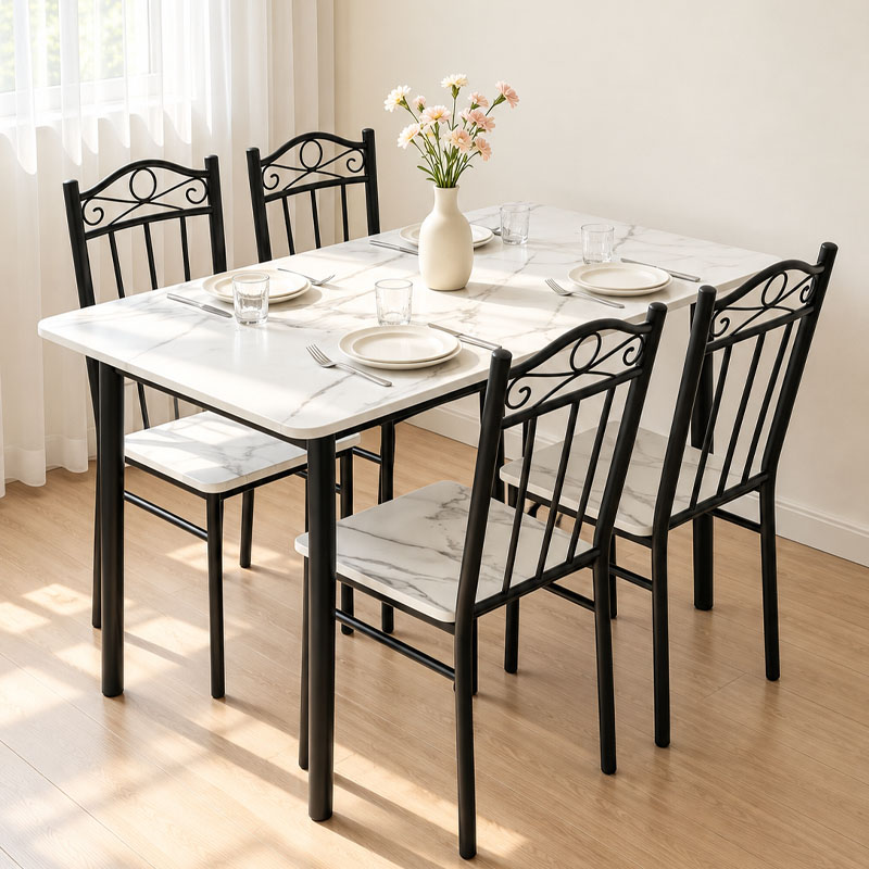 White marble-look dining table with four black scroll-back chairs, place settings and a flower vase White marble-look dining table with four black scroll-back chairs, place settings and a flower vase